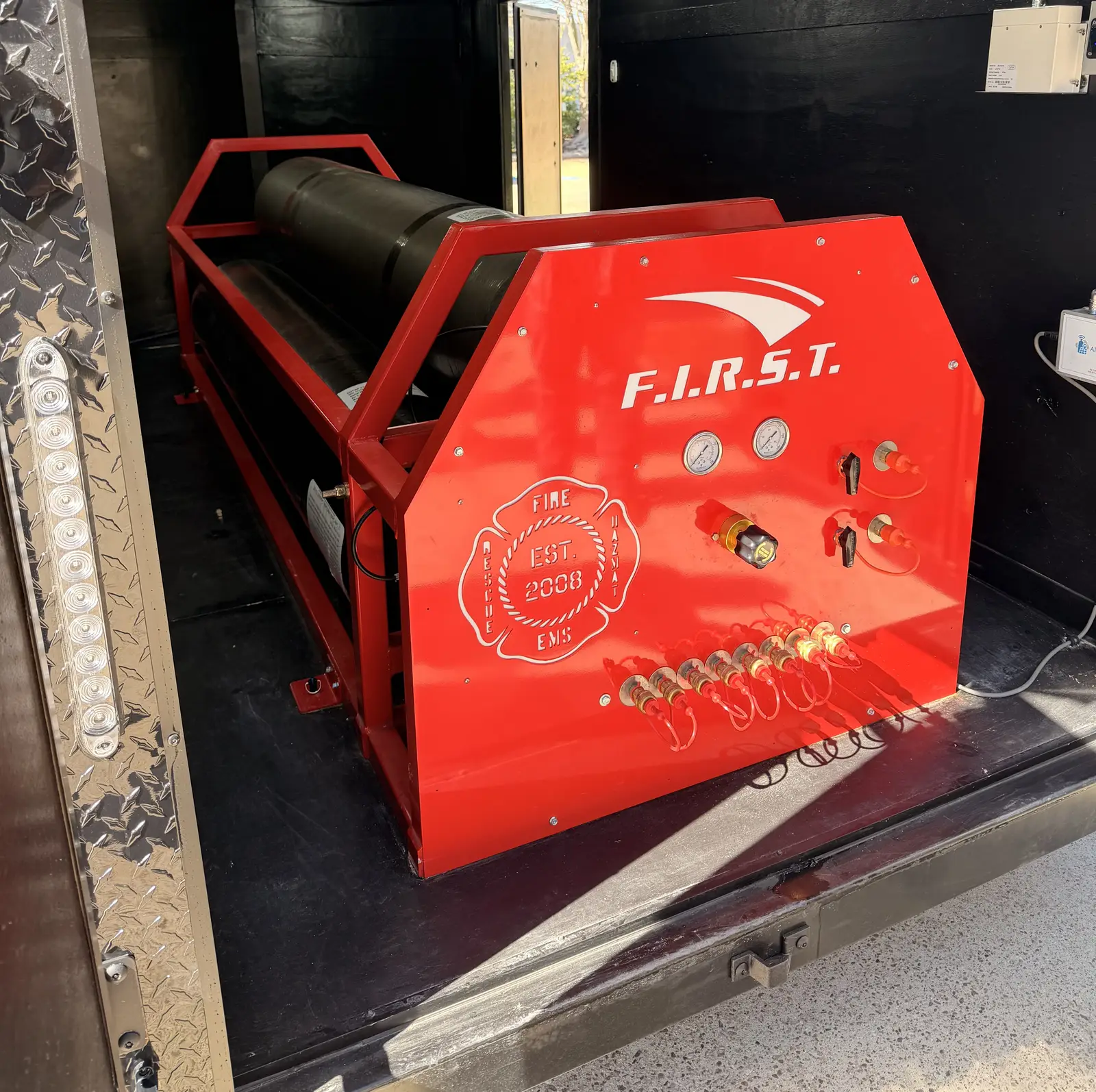 High-volume carbon fiber breathing air cylinder inside the trailer